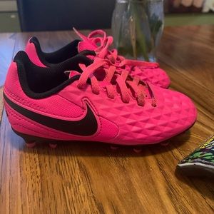 Size 11(child’s) pink Nike soccer cleats and junior shin pads